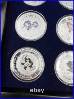 44 2008 Beijing Olympics Coin Set with 42 1 Oz. 999 Silver Coins & 2 Silver Medals